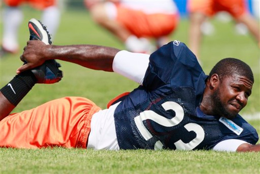 Chicago Bears' Devin Hester warms up before practice at team's