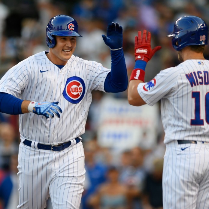 Chicago Cubs' Patrick Wisdom (16) celebrates after hitting a home