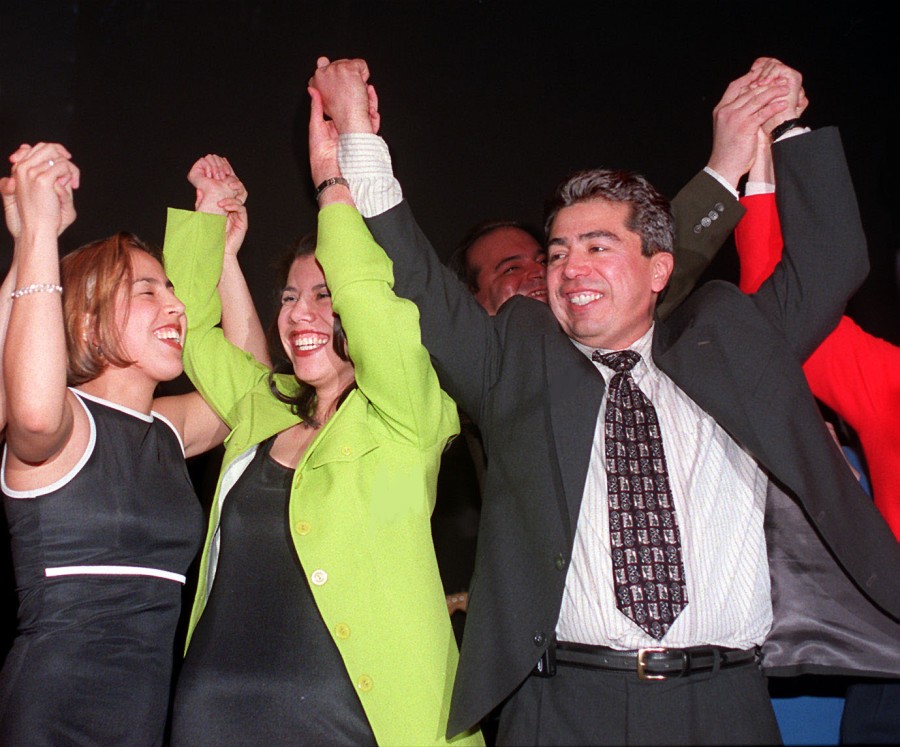 Then-Ald. Daniel Solis (25th) celebrates his runoff election victory in 1997 with daughters Marisol (left) and Maya (center) at the Apollo 2000 Theater.