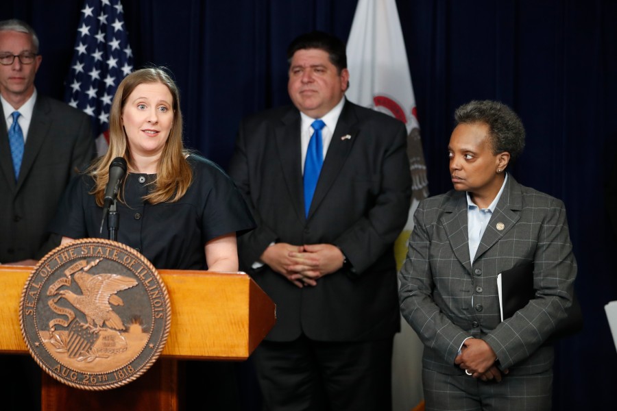 Dr. Emily Landon, left, speaks at a news conference on March 20, 2020, in Chicago