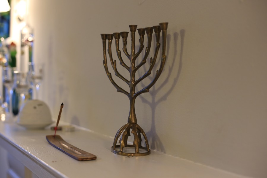 Northwestern student Callie Stolar displays a bronze Hanukah menorah at her apartment in Evanston.