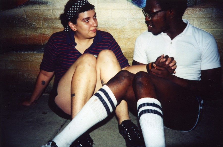 Two friends sit outside the Fireside in July 2004.