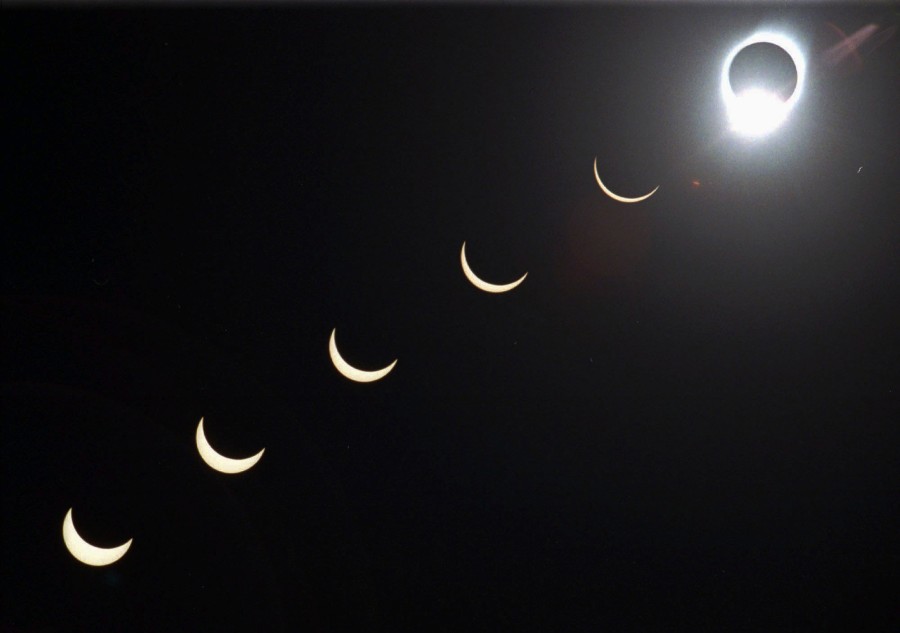 The progression of a total solar eclipse is seen in a multiple-exposure photo taken in 5-minute intervals, with the moon passing in front of the sun above Siem Reap in northwestern Cambodia in October 1995.