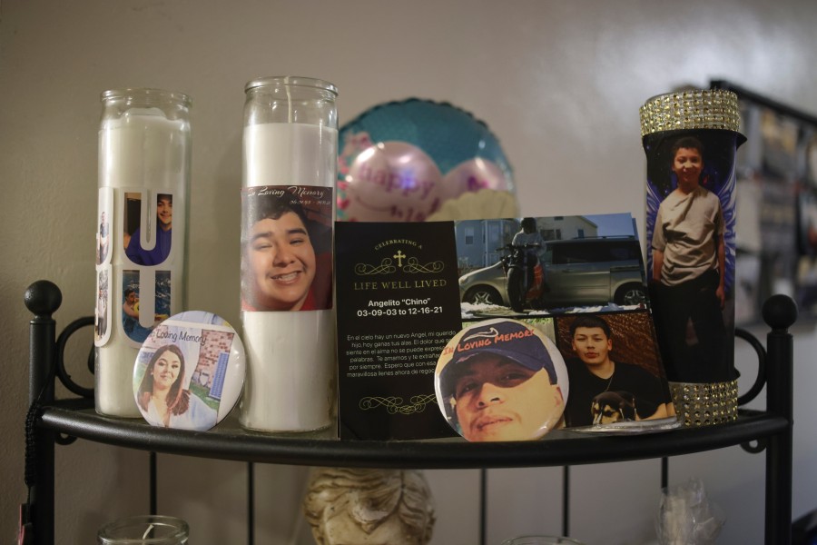 Photos on candles of past victims of families Cecilia Mannion has supported