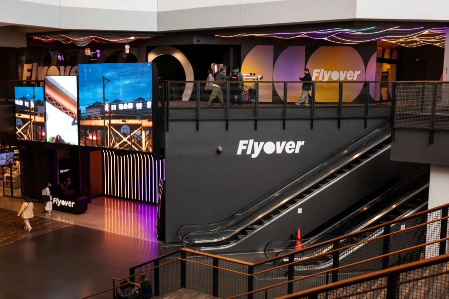 People walk by Flyover, a new immersive experience that combines an IMAX-like movie and a physical ride at Navy Pier. The attraction opens at 11 a.m. March 1, across from the Chicago Children’s Museum.